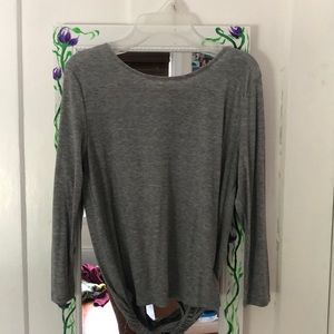 gray long sleeve blouse with opening in the back